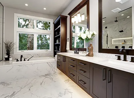Bathroom with stone floor and wood cabinets