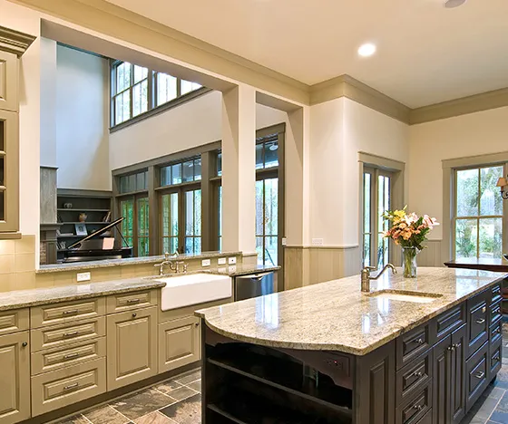 Kitchen with opening between wall and living room